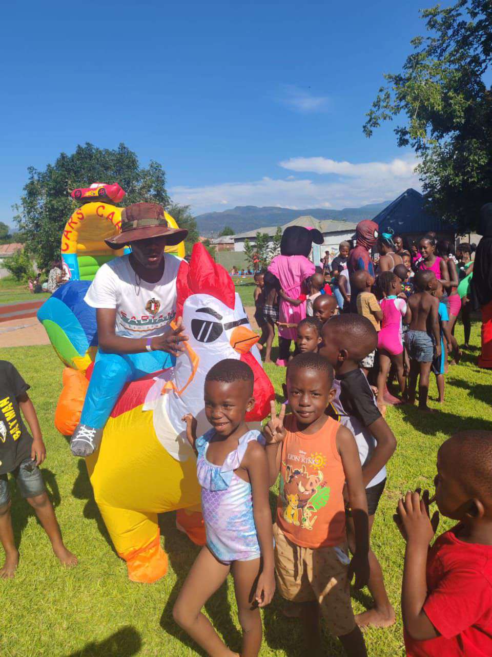 Children enjoying the Family Feast Funday mascot